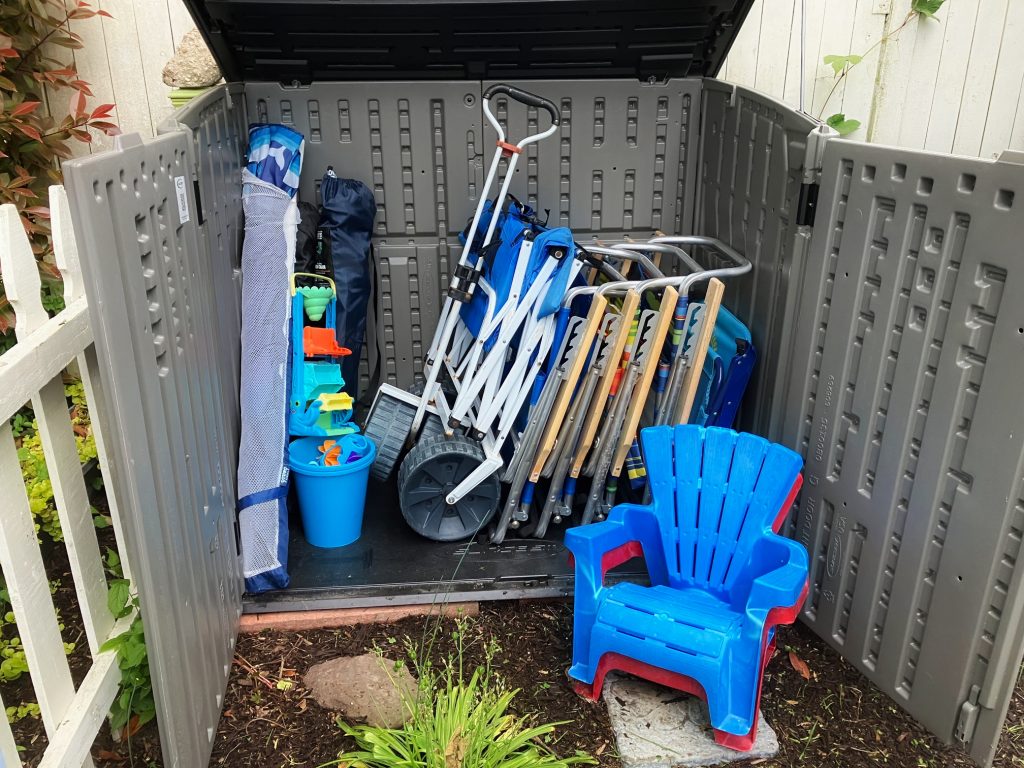 Beach chair cart and umbrella in the guest storage shed